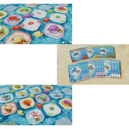 A composite view of the Shallow Sea Nesting Season Expansion game parts showing colorful ocean habitat tiles, wooden creature tokens, and two piles of blue cards