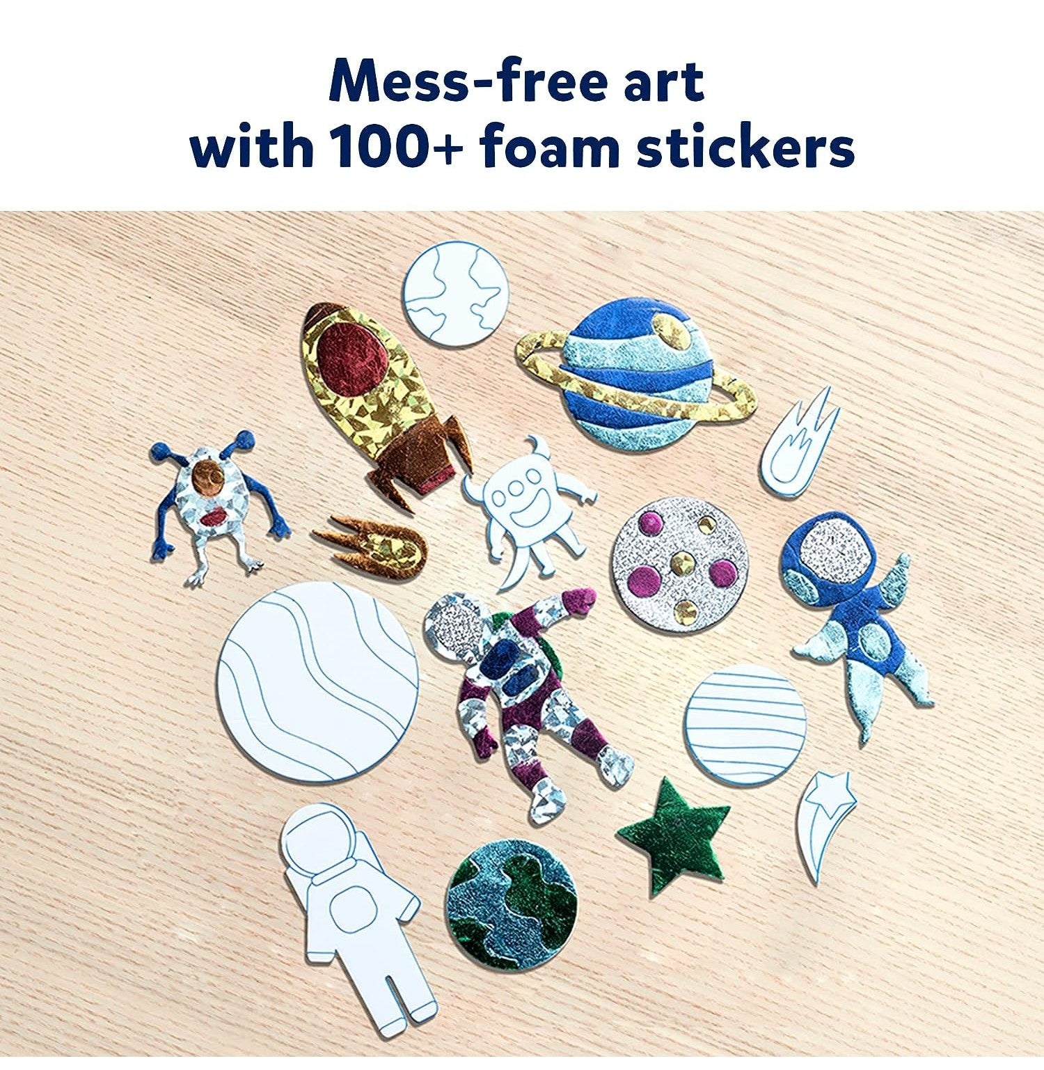 An array of colorful, textured foam and foil stickers featuring astronauts, stars, planets, and rockets arranged on a light wood table with overlaid marketing text