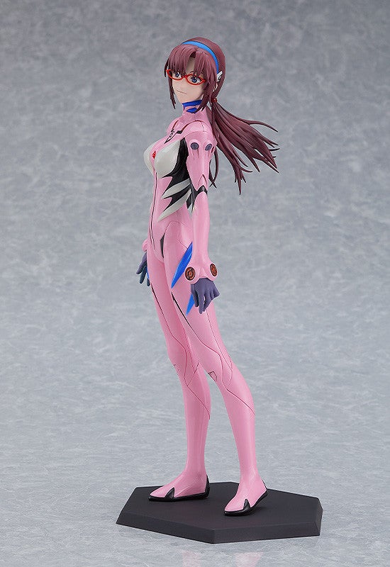 Mari Illustrious Makinami figurine in pink plugsuit, red glasses, and blue headband, looking over shoulder on a dark base