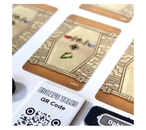 Assorted components from Loot Box #1 including cards and dice