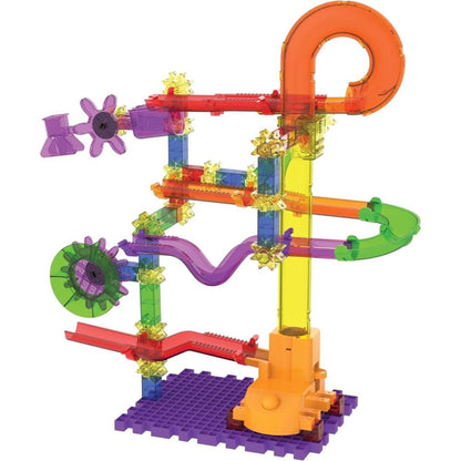 Translucent colourful marble run toy with tracks, gears, and funnels, built on a purple base
