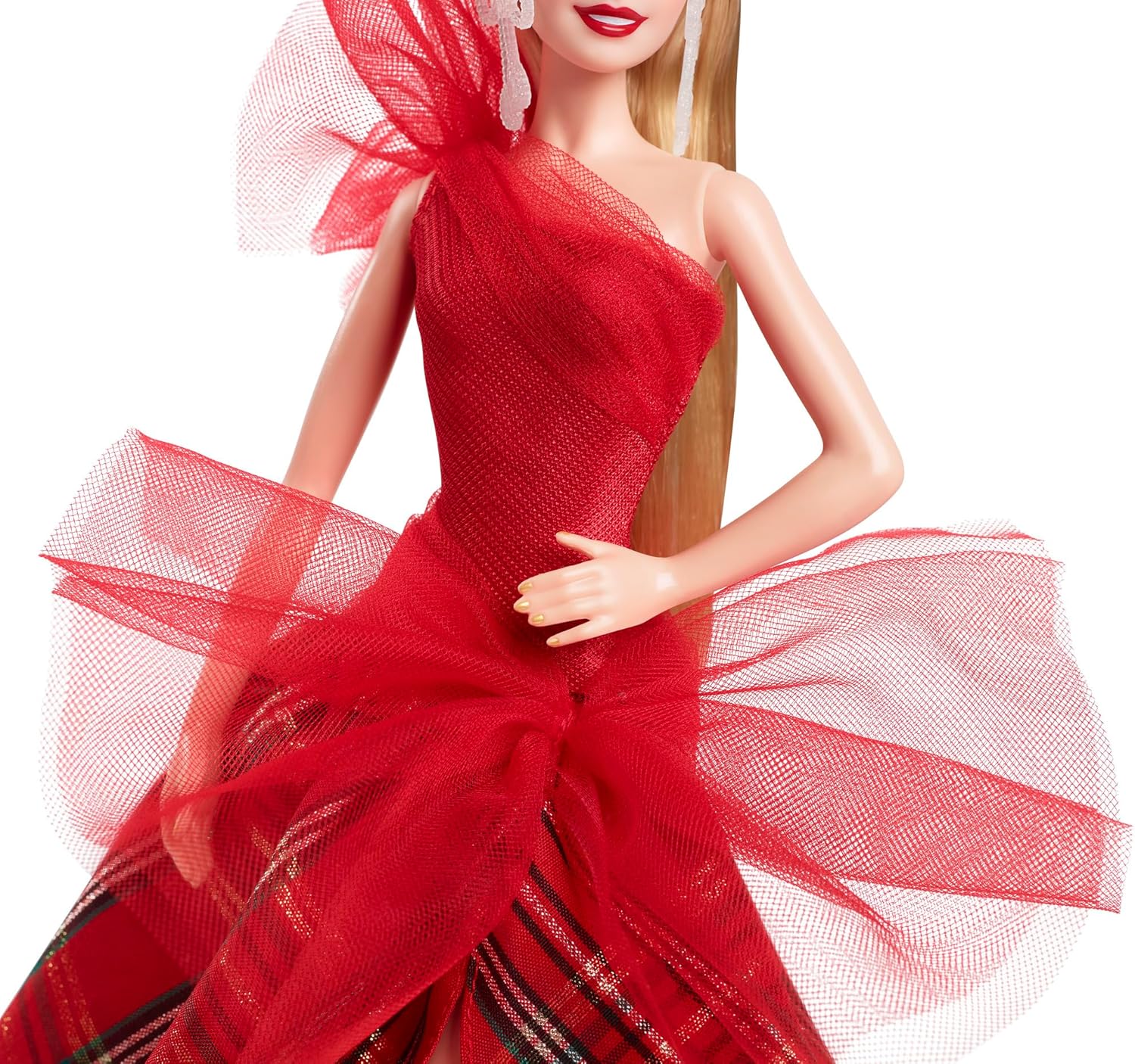 Close-up of Barbie doll in a red one-shoulder dress featuring a large tulle bow and a red plaid skirt