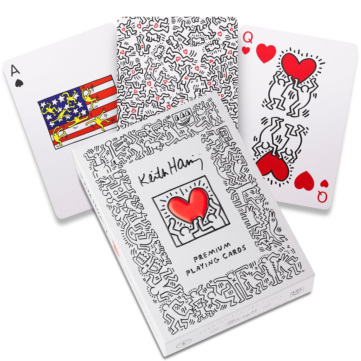 Box and three fanned Keith Haring playing cards featuring pop art stick figures, hearts and black/white design