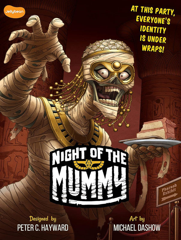 A cartoon mummy with a gold mask reaches out, holding cake, in an Egyptian exhibit. "Night of the Mummy" title