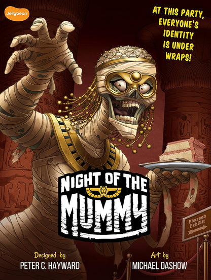 A cartoon mummy with a gold mask reaches out, holding cake, in an Egyptian exhibit. "Night of the Mummy" title