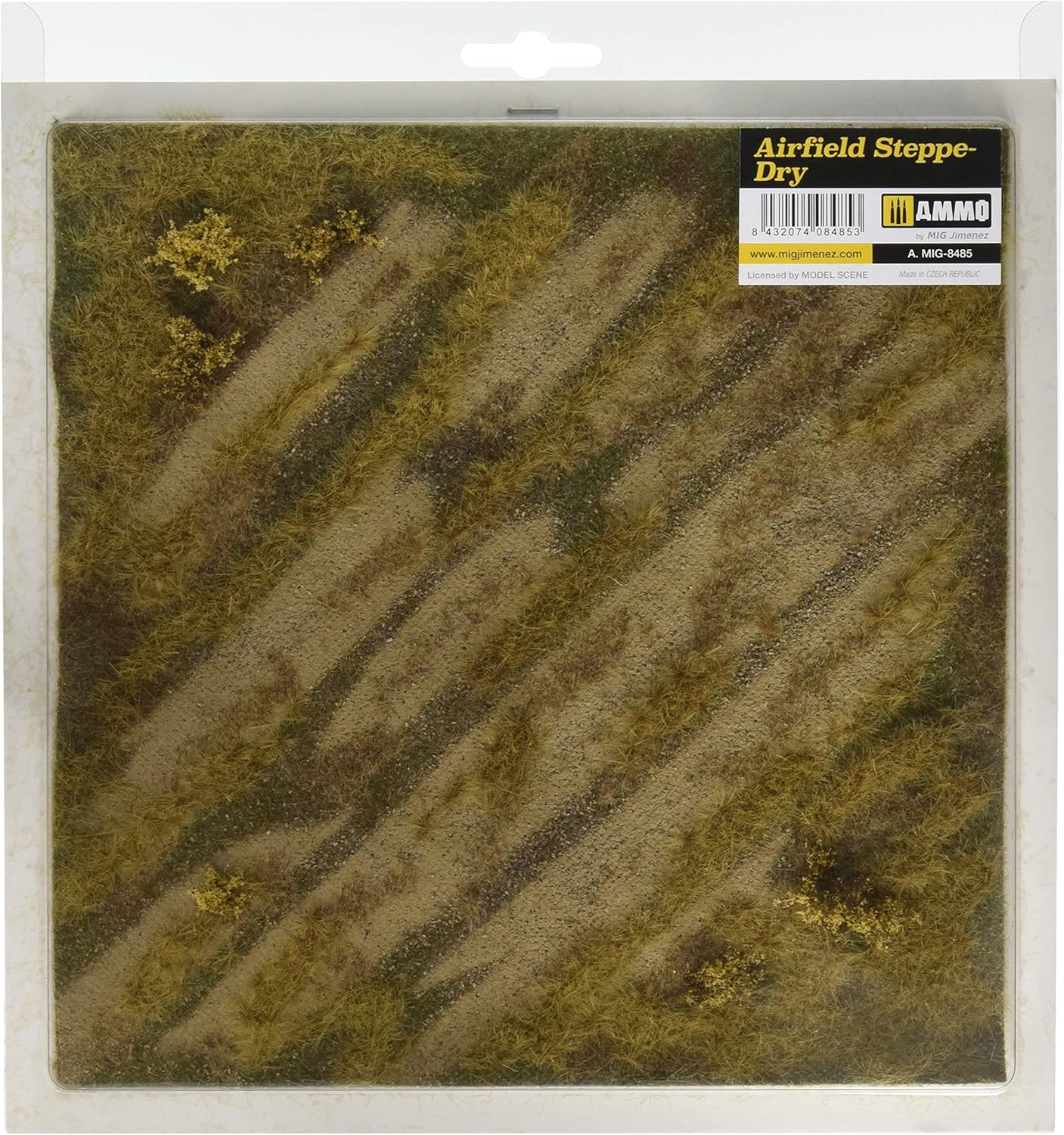 A packaged 'Airfield Steppe-Dry' model terrain mat with dry grass, diagonal dirt paths, and yellow shrubs.