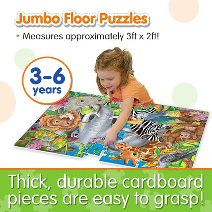 Young girl placing a piece into a large, colorful jungle animal floor puzzle