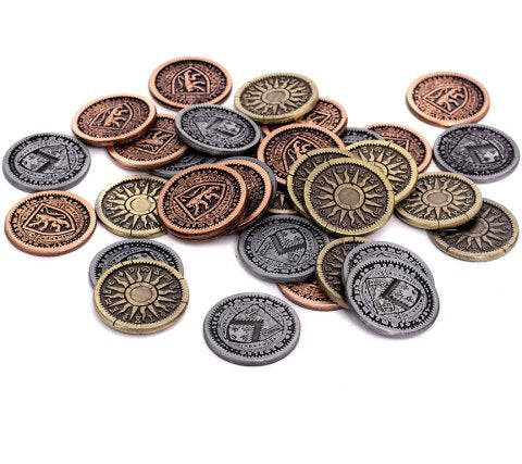 The Witcher Old World metal coins in bronze silver and gold finishes scattered across a white surface