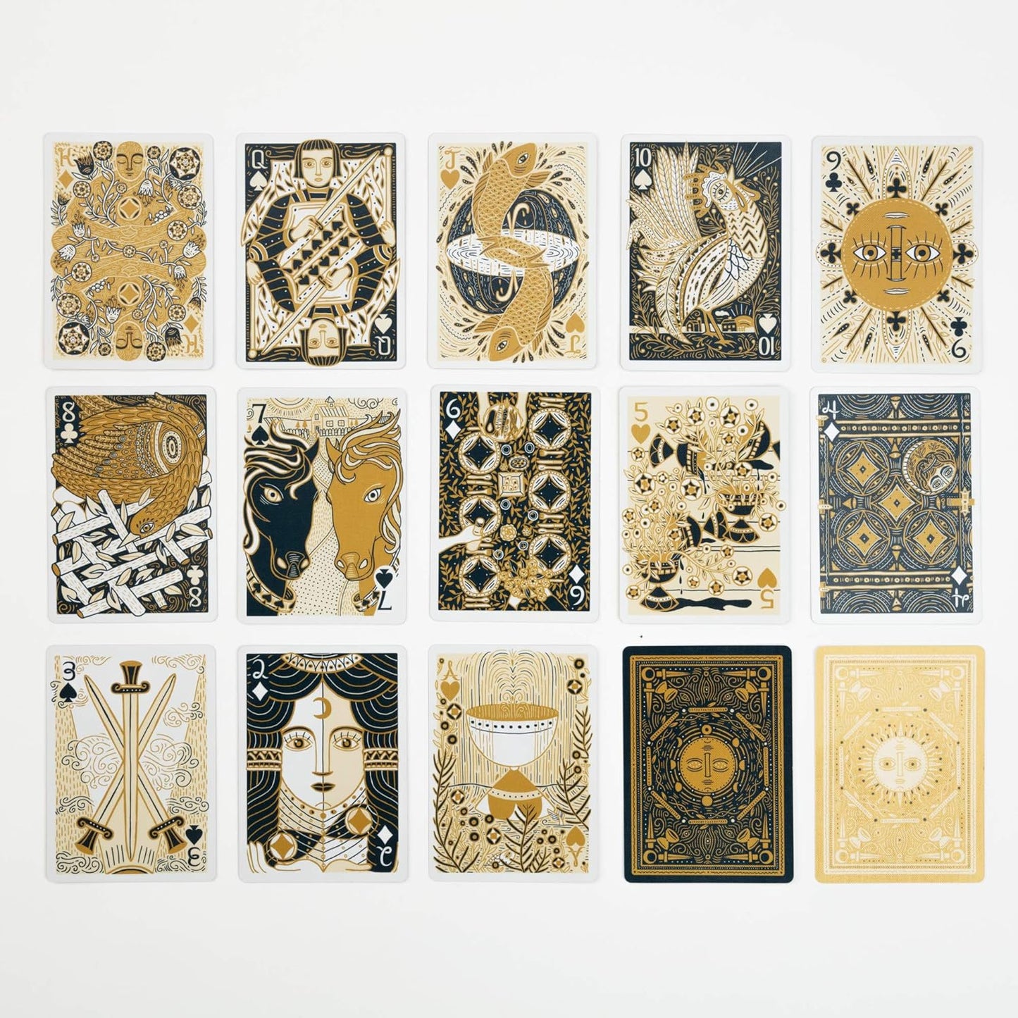 Fifteen custom playing cards with intricate gold -  blue -  and white designs of figures -  animals -  and symbols