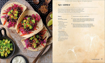 Three soft tacos filled with black beans -  purple slaw -  avocado -  and crispy insects -  on a rustic stone surface