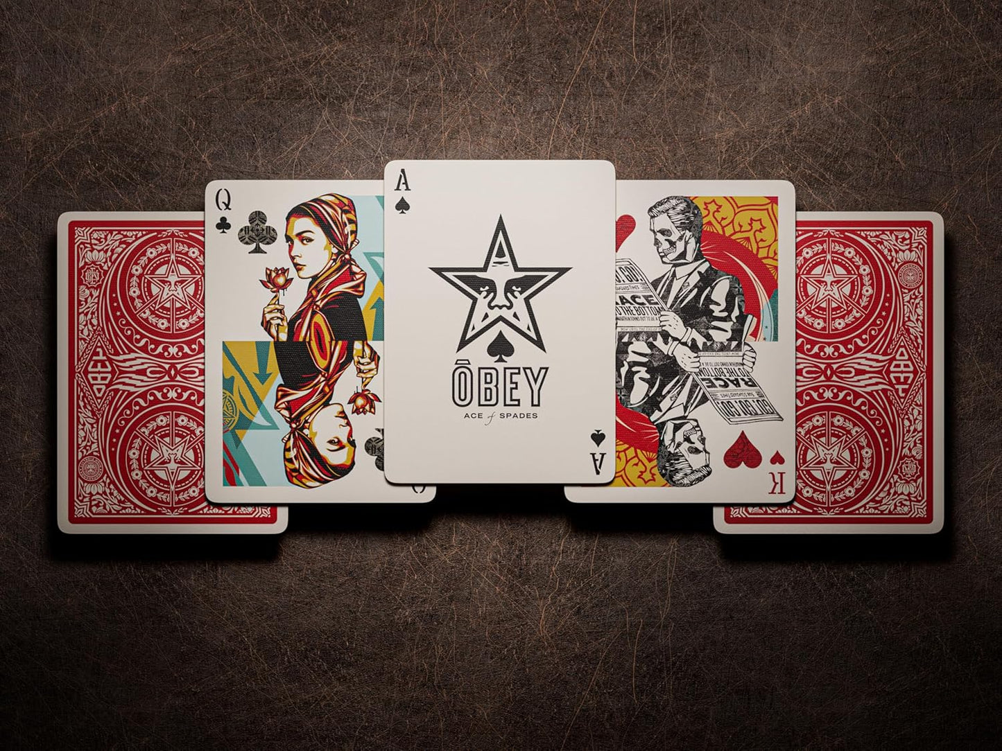 Custom Obey playing cards displayed: Ace of Spades, Queen of Clubs and King of Hearts featuring street art style illustrations