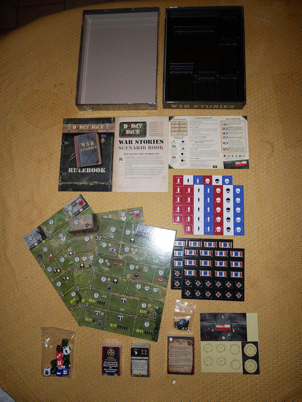 Unboxed D-DAY DICE: WAR STORIES board game set. Rulebook, green map tiles, dice, and colorful tokens laid out