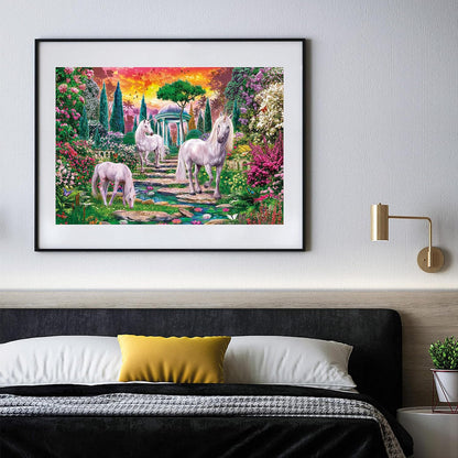 Painting of three white unicorns in a vibrant fantasy garden under a sunset sky, hanging above a bed