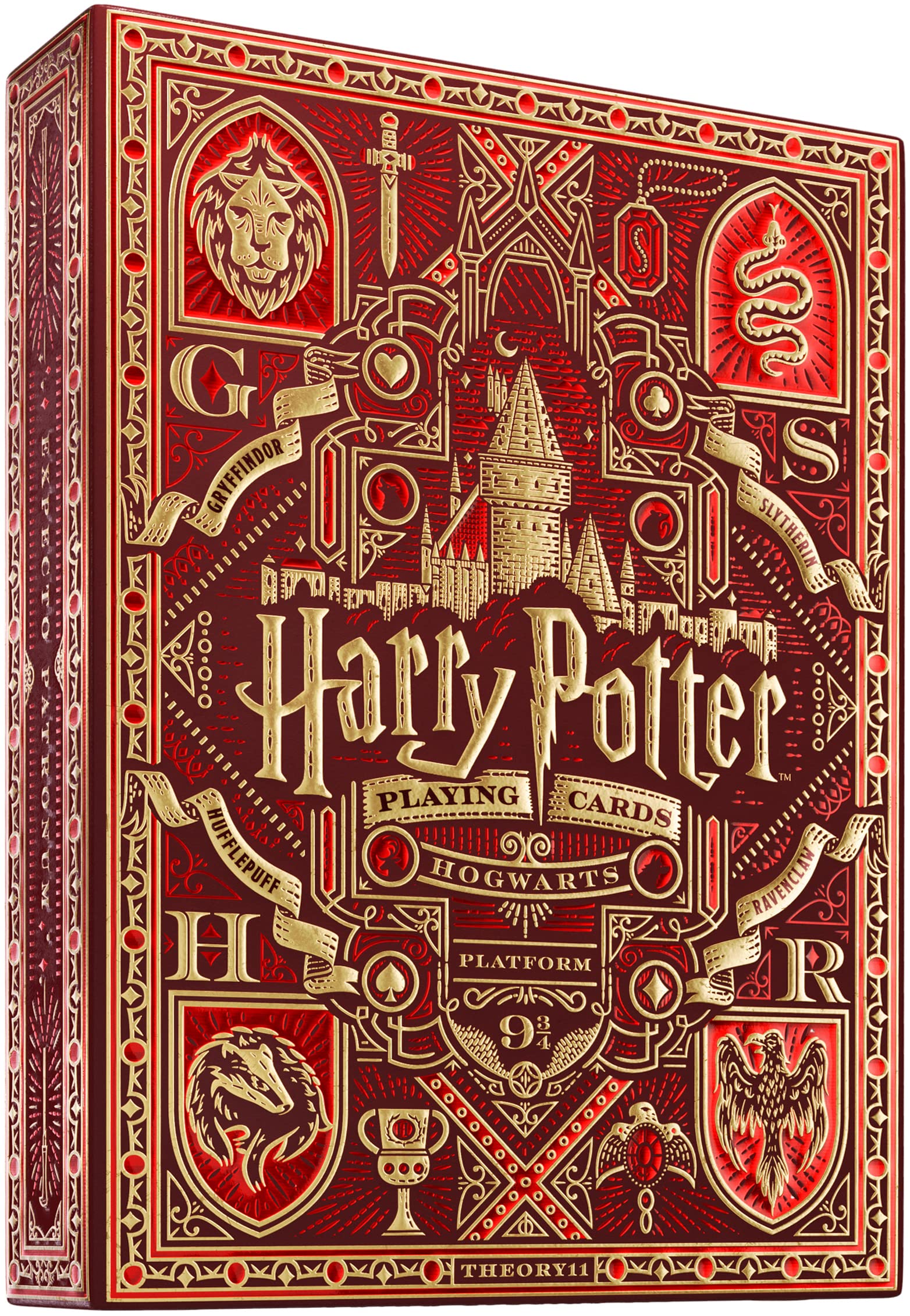Ornate red and gold Harry Potter playing card box featuring Hogwarts, house crests, and magical symbols