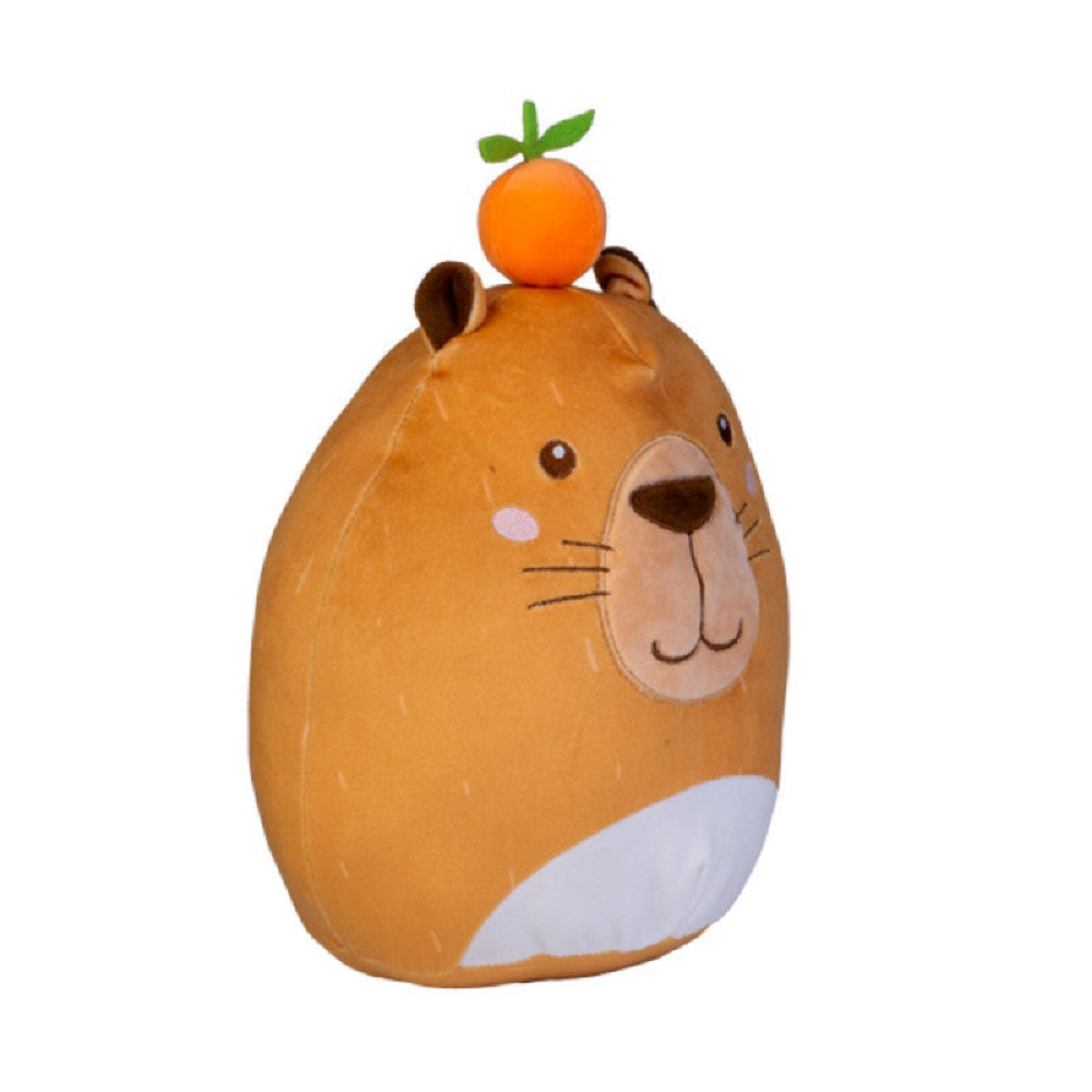The adorable Smooshos Pal Capybara stuffed animal, a rounded brown plush with embroidered face details and a tiny orange perched on top
