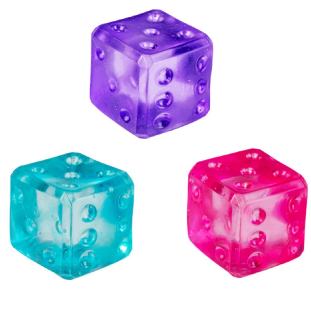 This image features three glossy, translucent squishy dice toys in distinct colors: bright purple, hot pink, and clear teal