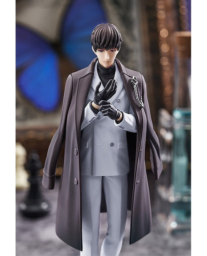 Anime figure of a man in a charcoal trench coat light grey suit black turtleneck and black gloves