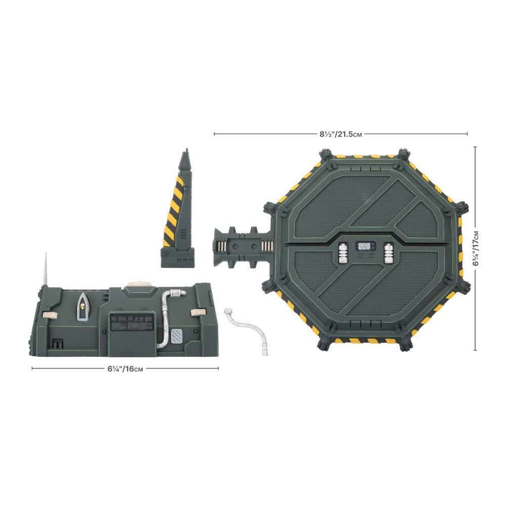 Various parts of a Gothic Sector - Legion Chapel Barracks model kit, including an octagonal base, a long building, a spiky tower, and a flexible pipe