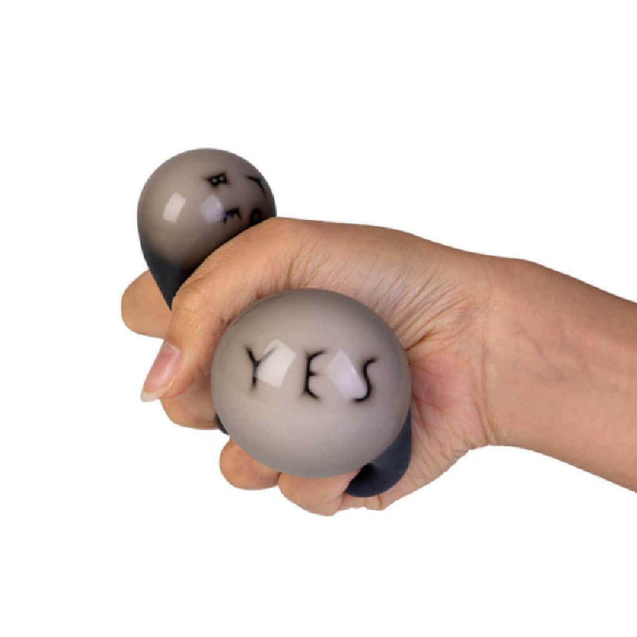 Hand holding a gray two-ball stress reliever; one ball says "YES"