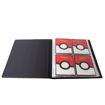 Open black trading card binder holding four Pokemon cards backed with a Poke Ball design
