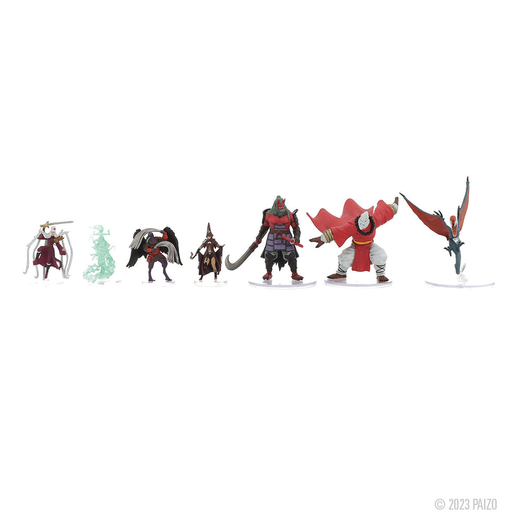 A line of seven detailed fantasy miniatures including armored warriors, a ghostly figure, and a flying creature