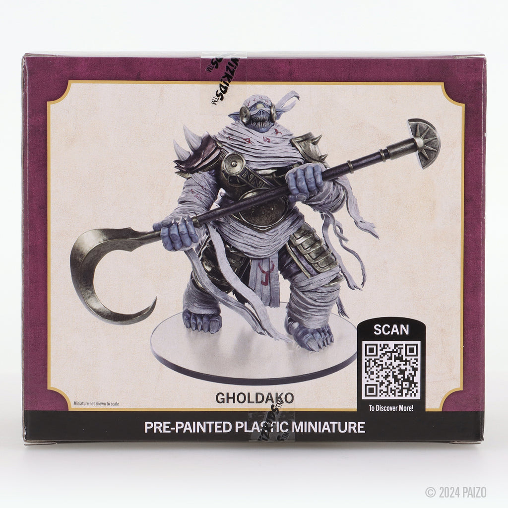 Gholdako pre-painted plastic miniature: a bandaged blue humanoid creature holding a staff with a scythe and mace head