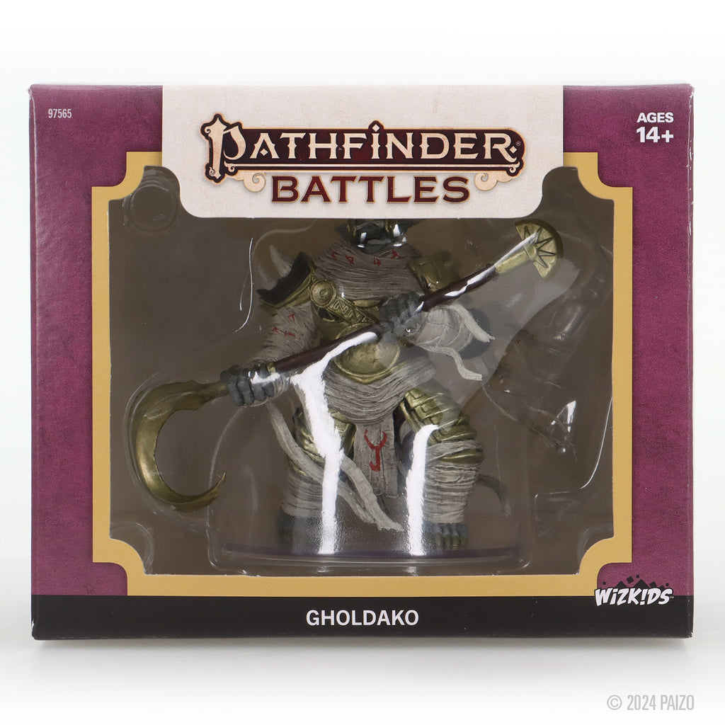 Pathfinder Battles Gholdako miniature in box: An armored, bandaged mummy figure holding a large curved scythe