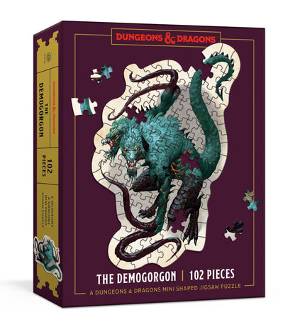 A Dungeons & Dragons Demogorgon 102-piece mini shaped jigsaw puzzle box showing the monster artwork with loose pieces
