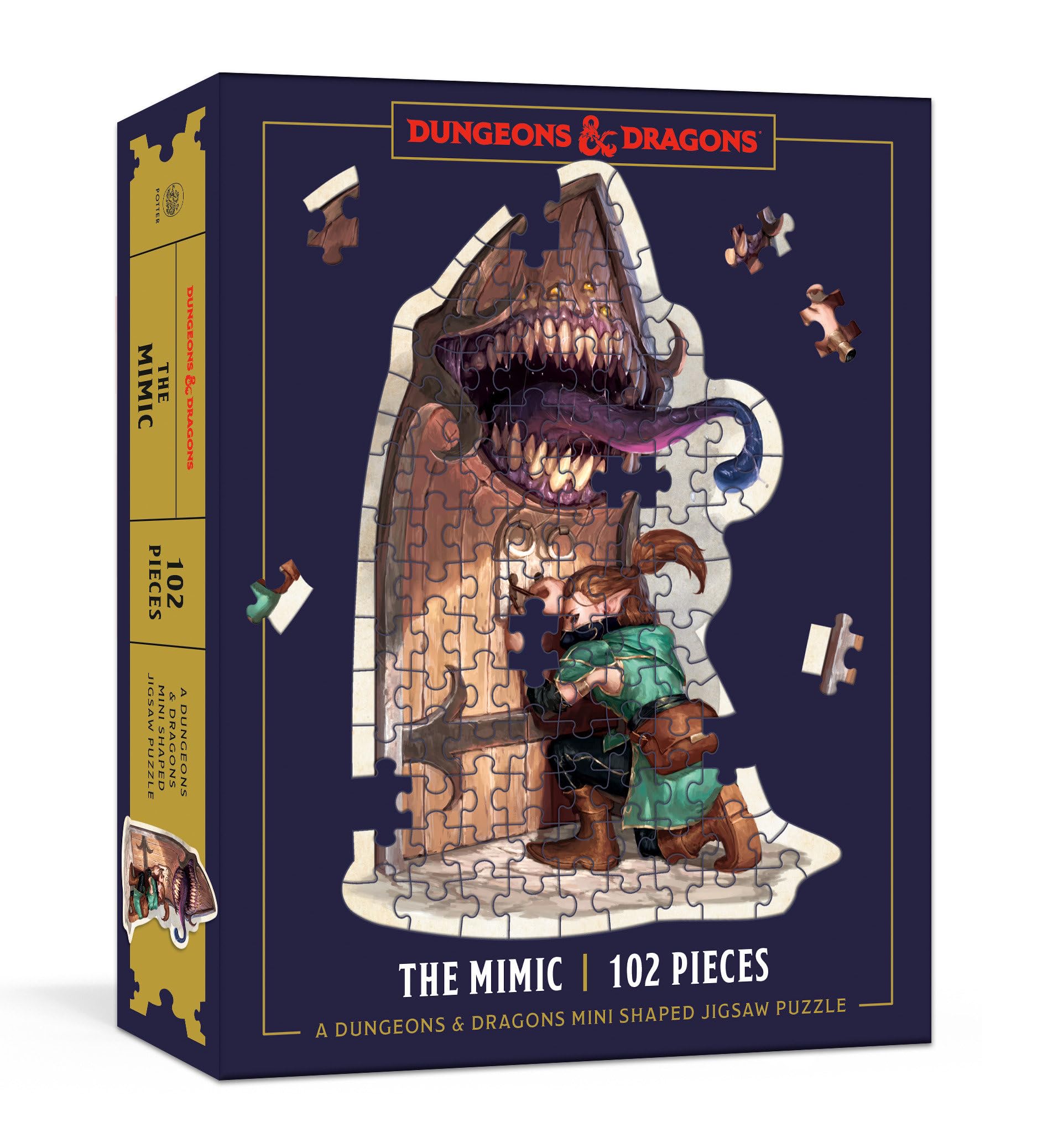 A box for a Dungeons & Dragons Mimic 102-piece shaped jigsaw puzzle, featuring an adventurer attempting to open a monstrous wooden door with fangs and a tongue