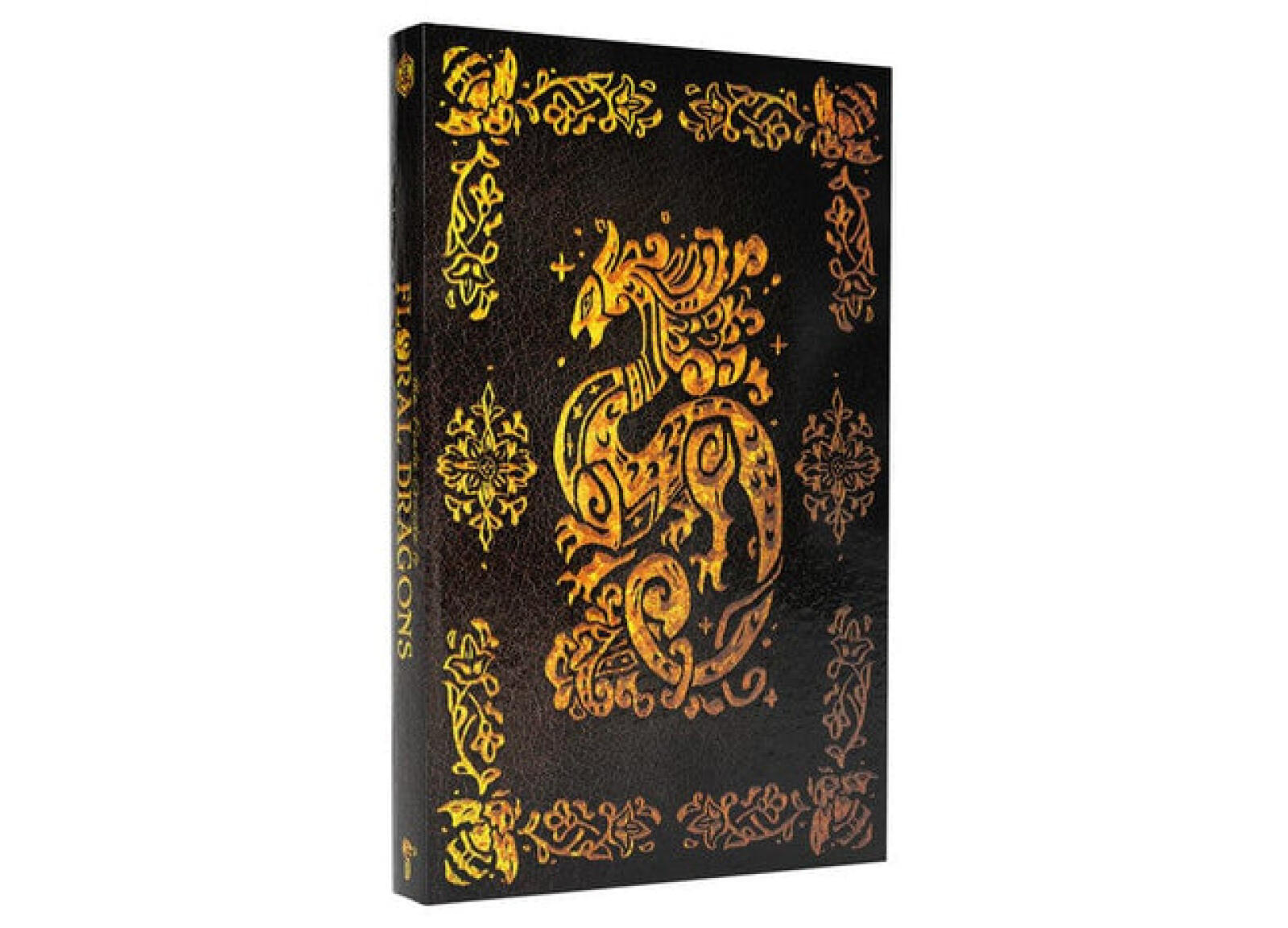 A dark book with a gold embossed stylized dragon and ornate patterns. Spine reads "FLORA DRAGONS"