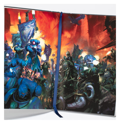 The First Founding (Hardback) open to a vibrant illustration of blue armored soldiers battling dark, monstrous figures across a spread, marked by a blue ribbon bookmark