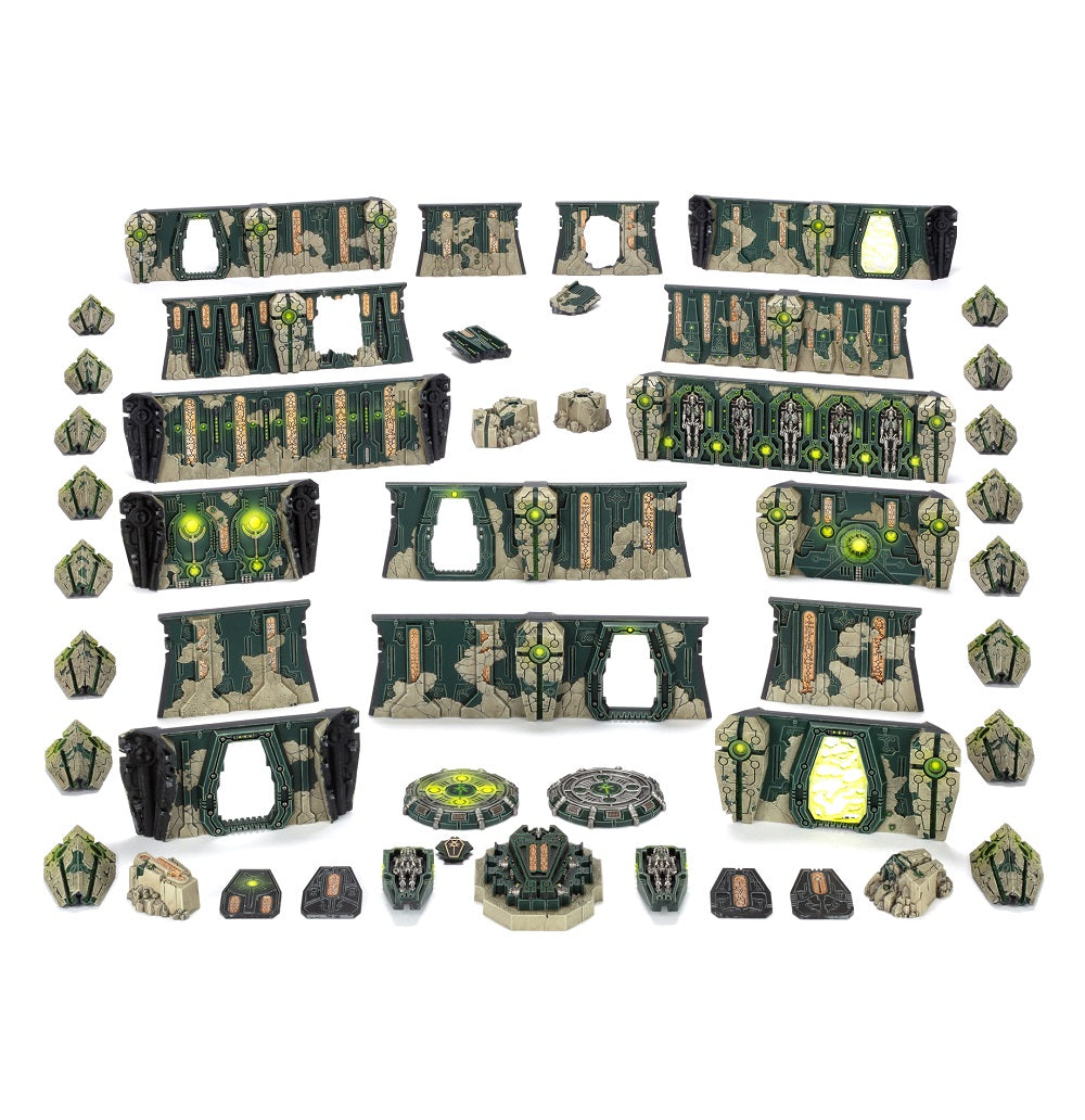 Necron-themed modular tabletop terrain pieces, including detailed walls and barriers with glowing green energy effects