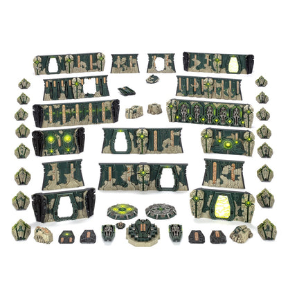 Necron-themed modular tabletop terrain pieces, including detailed walls and barriers with glowing green energy effects