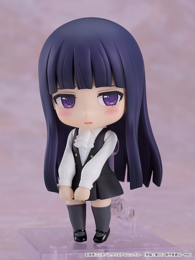 Nendoroid figure of a girl with long dark purple hair, purple eyes, white blouse, black uniform, standing shyly.