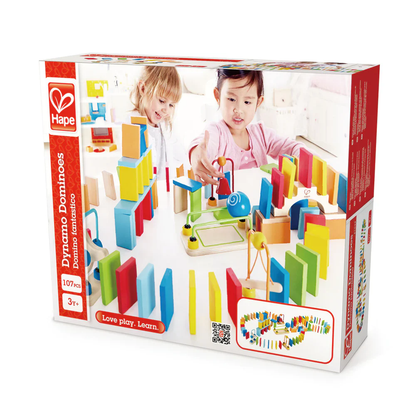 Hape Dynamo Dominoes product box with two girls setting up colorful wooden blocks and chain reaction toys