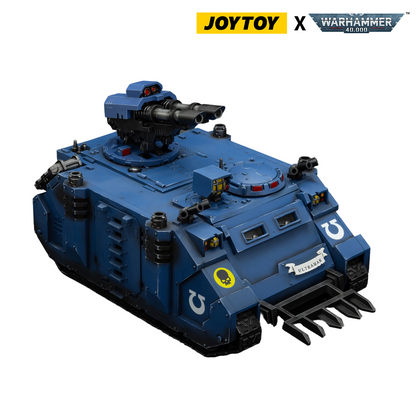 Blue Warhammer 40K Ultramarines armored transport model with turreted heavy bolters and front plow