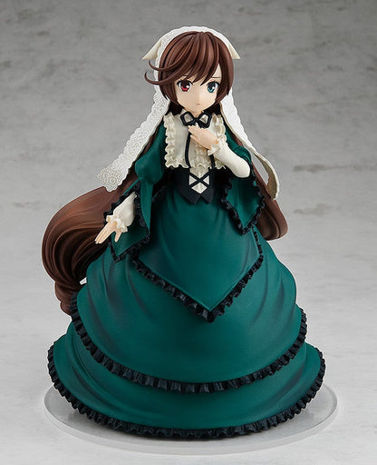 Anime figure of a woman in a flowing dark green Victorian dress with black ruffles white ruffled collar