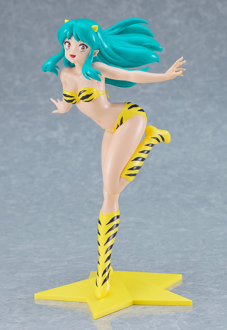 Lum figure in yellow tiger stripe bikini with long teal hair on yellow base