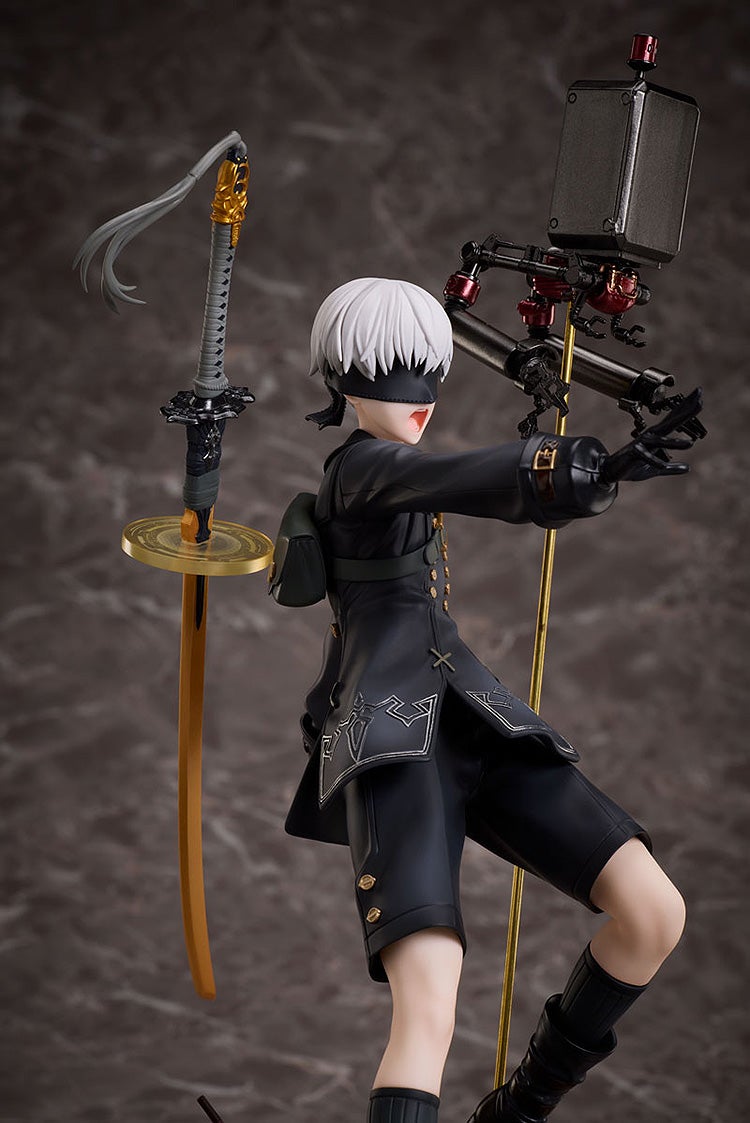 NieR Automata 9S figurine: White-haired, blindfolded male in black, arm extended, mouth open, beside a katana and a robot Pod