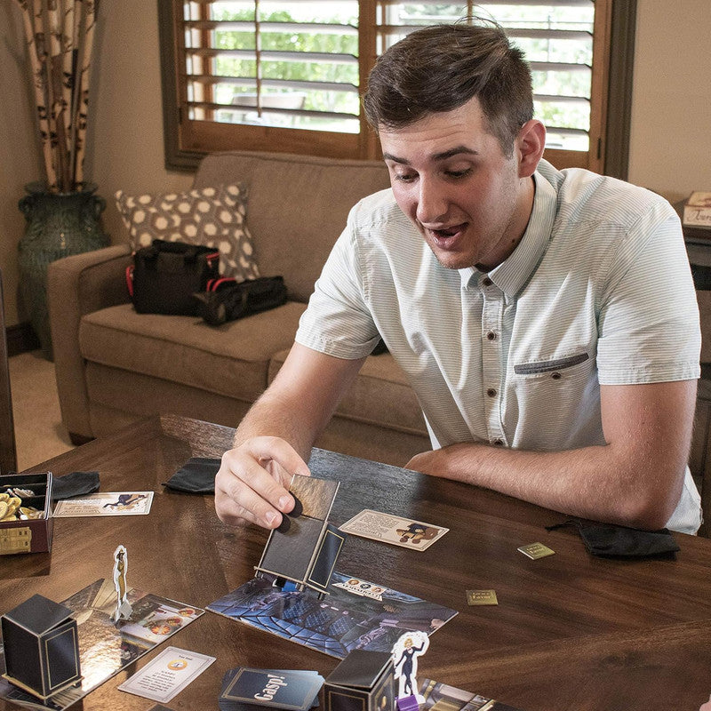 Man playing a board game at home on a wooden table
