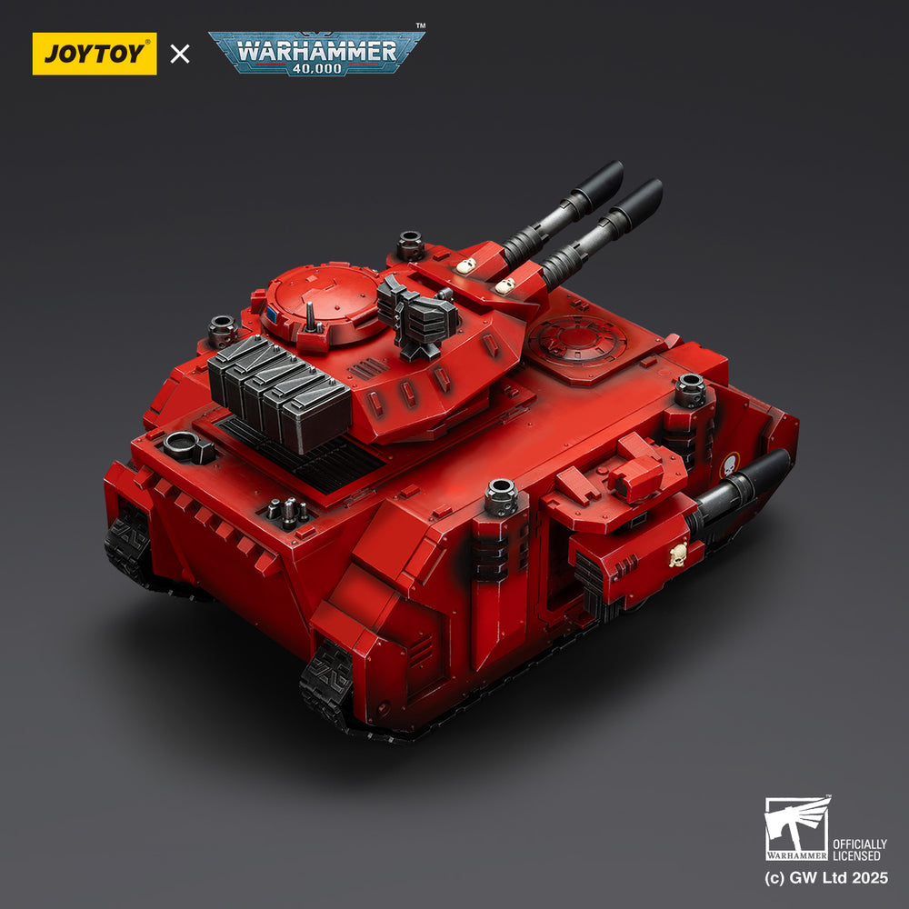 A red Warhammer 40,000 tank model with twin black cannons mounted on its turret