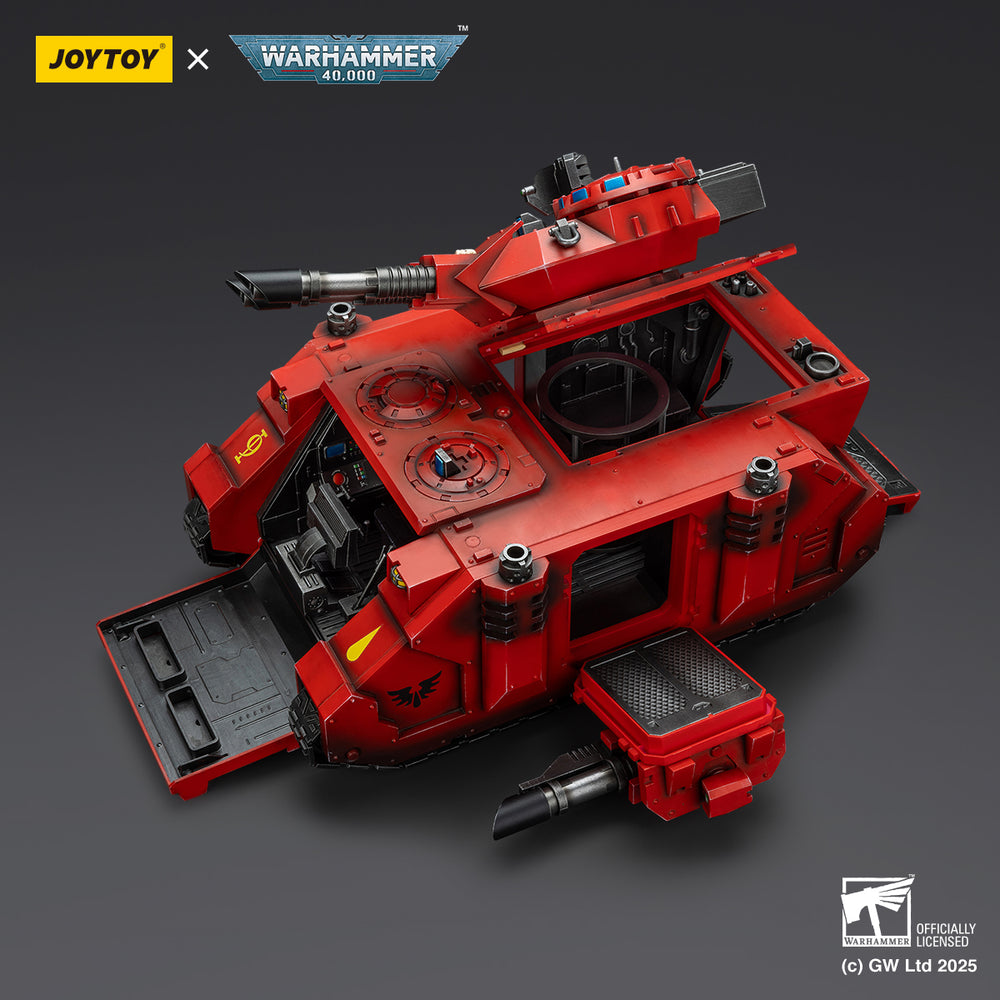 A detailed red Warhammer 40,000 armored vehicle model with an open front ramp and top hatches, revealing its interior