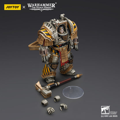 A detailed Warhammer Horus Heresy armored figure, gold, silver, and black with hazard stripes, heavy weapon, a hammer, and hands