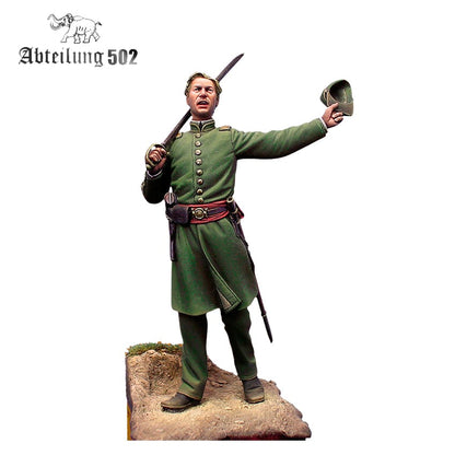A 54mm 5th Georgia Infantry Clinch Rifles 1861 figure in a green uniform holds a sword over his shoulder and a hat in his raised hand on a terrain base