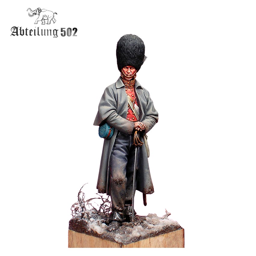 A detailed miniature Grenadier Guard Inkerman 1854 Figure wearing a tall fur hat, grey coat, and red uniform, holding a sword on a snowy base