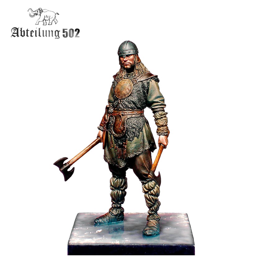 Scale model of a Viking warrior in a helmet and fur clothing, holding two battle axes
