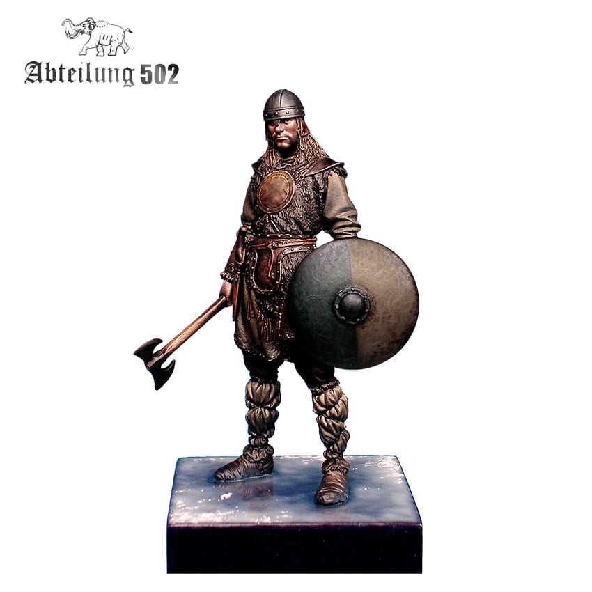 Miniature Viking warrior in helmet and armor, holding an axe and a round shield on a display base