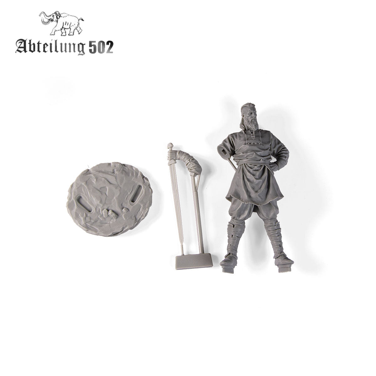 A gray resin model kit showing a bearded man, a textured base, and a separate staff accessory on a white background