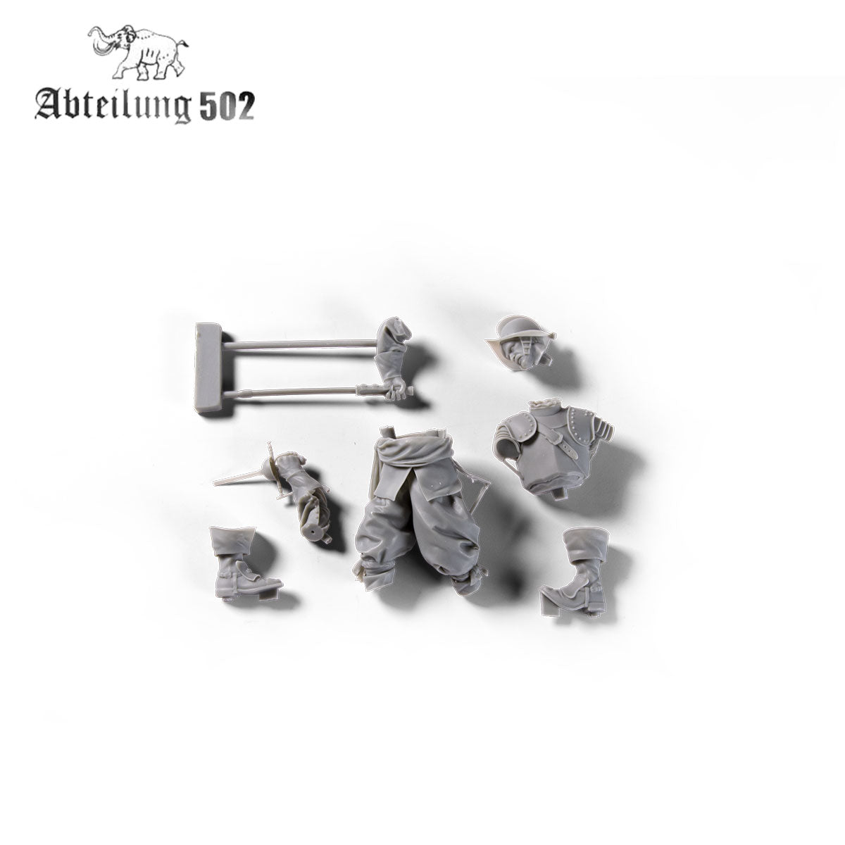Various gray resin parts for a Spanish Tercios Soldier Figure including a torso, legs, head with helmet, arms with weapons, and boots on a white background