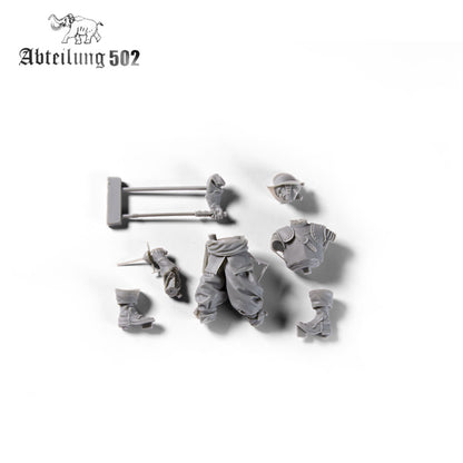 Various gray resin parts for a Spanish Tercios Soldier Figure including a torso, legs, head with helmet, arms with weapons, and boots on a white background